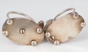 STOKES & SONS of Melbourne pair of antique Australian silver plated spiral napkin rings with kookaburra and emu, 19th/20th century, 5cm high. - 2