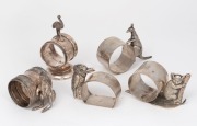 Five assorted antique silver plated napkin rings adorned with Australian animals including rare koala, kookaburra, emu and two kangaroos, 19th/20th century, the largest 10cm high.