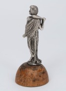 An antique solid cast silver statuette of an Aboriginal male figure in possum skin cloak holding a club, unknown maker, 19th century, mounted on later wooden plinth, ​​​​​​​8cm high overall, 56 grams total. - 2