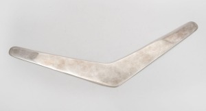 86 · An antique Australian silver boomerang, 19th/20th century, stamped "STG. SILVER", ​​​​​​​29cm long, 128 grams.