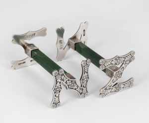 69 · FRANK GRADY of Wellington pair of antique New Zealand silver and greenstone "N.Z." knife rests, 19th/20th century, stamped "F. GRADY, ST. SILVER", 4cm high, 8cm wide.
