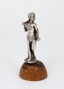 An antique solid cast silver statuette of an Aboriginal male figure in possum skin cloak holding a club, unknown maker, 19th century, mounted on later wooden plinth, ​​​​​​​8cm high overall, 56 grams total.