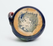 REMUED&nbsp;pottery jug with applied gumnuts, branch handle and leaf, glazed in pink, blue and green, incised "Remued, Hand Made, 173SM", 7cm high, 12cm wide - 2