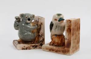 Two left-hand pottery bookends adorned with koalas and kookaburra, 13.5cm and 14cm high