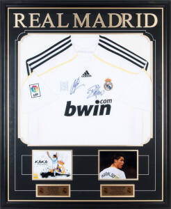 REAL MADRID: Real Madrid home shirt signed by Cristiano Ronaldo & Kaka, window mounted with photographs of each footballer, framed & glazed, overall 90x111cm. With CoA.