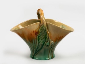 286 · REMUED green glazed pottery basket vase with applied gum nuts and leaf, incised "Remued, 194/10M", 20cm high, 26.5cm wide