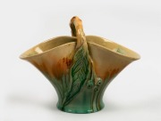 REMUED&nbsp;green glazed pottery basket vase with applied gum nuts and leaf, incised "Remued, 194/10M", 20cm high, 26.5cm wide&nbsp;
