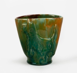 254 · UNA DEERBON (attributed) green and yellow glazed pottery vase with Scotty dog decoration, signature illegible under slumped glaze, 10.5cm high