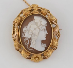 An antique gold mounted cameo brooch adorned with kangaroo and emu in foliate design, 19th century, 5cm high, 14.2 grams total including cameo