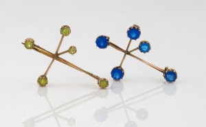 Two antique Australian 9ct gold "SOUTHERN CROSS" brooches with coloured stones, circa 1900, both stamped "9ct", one with inscription dated 1909, ​​​​​​​the larger 4cm wide, 5.1 grams total