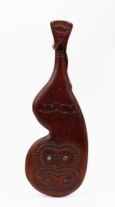 MAORI carved kauri patu with paua shell eye decoration, 20th century, ink stamp verso "Kauri, Hand-Made in New Zealand by Terewa Kerekere", 37cm long