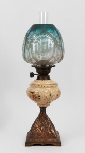 An antique oil lamp with cast copper base, hand-painted glass font, black button double burner and original blue glass shade with glass chimney, 19th century, ​​​​​​​59cm high overall