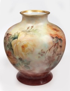 A hand-painted floral porcelain vase with rose decoration, signed "Hansen", 31cm high
