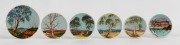 GUY BOYD group of six pottery dishes and plaques with hand-painted Australian landscapes on blue ground, all incised "Guy Boyd", the largest 15.5cm diameter.