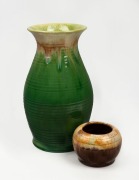 REMUED tall green glazed pottery vase, together with a squat brown glazed pottery vase with original foil label, (2 items), the larger 24cm high.