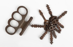 Rare set of Warder's alarm system keys, together with an antique knuckle duster,
