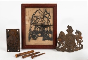 Convict cell door Warder's peep hole, group of three antique handmade convict nails from Port Arthur, a framed print titled "Instruments Used To Subdue Prisoners", and an antique British cast metal coat of arms, 19th/20th century, (6 items, the print 24 x 19cm overall.