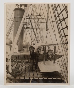 THE B.A.N.Z. ANTARCTIC EXPEDITION: Official original photograph by Captain Frank Hurley: Image A33 - Title: The Discovery's Long Arm, with official "MAWSON ANTARCTIC EXPEDITION" handstamp&nbsp;and release date "TUESDAY APR. 15,&nbsp;1930" verso, together with the o