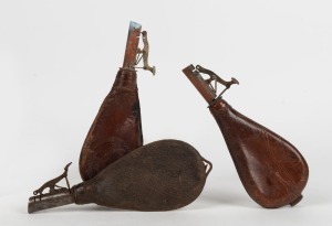 Three antique leather shot flasks, 19th century, the largest 22cm long.