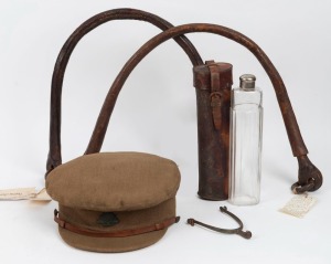 WWI officer's cap, Light Horse spur, two leather horse trace chains (used to prevent rattling noise when moving guns etc. at night); together with a glass flask in leather campaign case, (5 items)