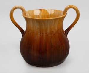 262 · JOHN CAMPBELL brown and yellow glazed two handle pottery mantle vase with banded decoration, incised "John Campbell, Tasmania", 27cm high, 32cm wide