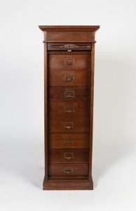 An antique Australian blackwood tambour fronted pedestal stationery cabinet fitted with eight drawers, circa 1910, 117cm high, 42cm wide, 59cm deep