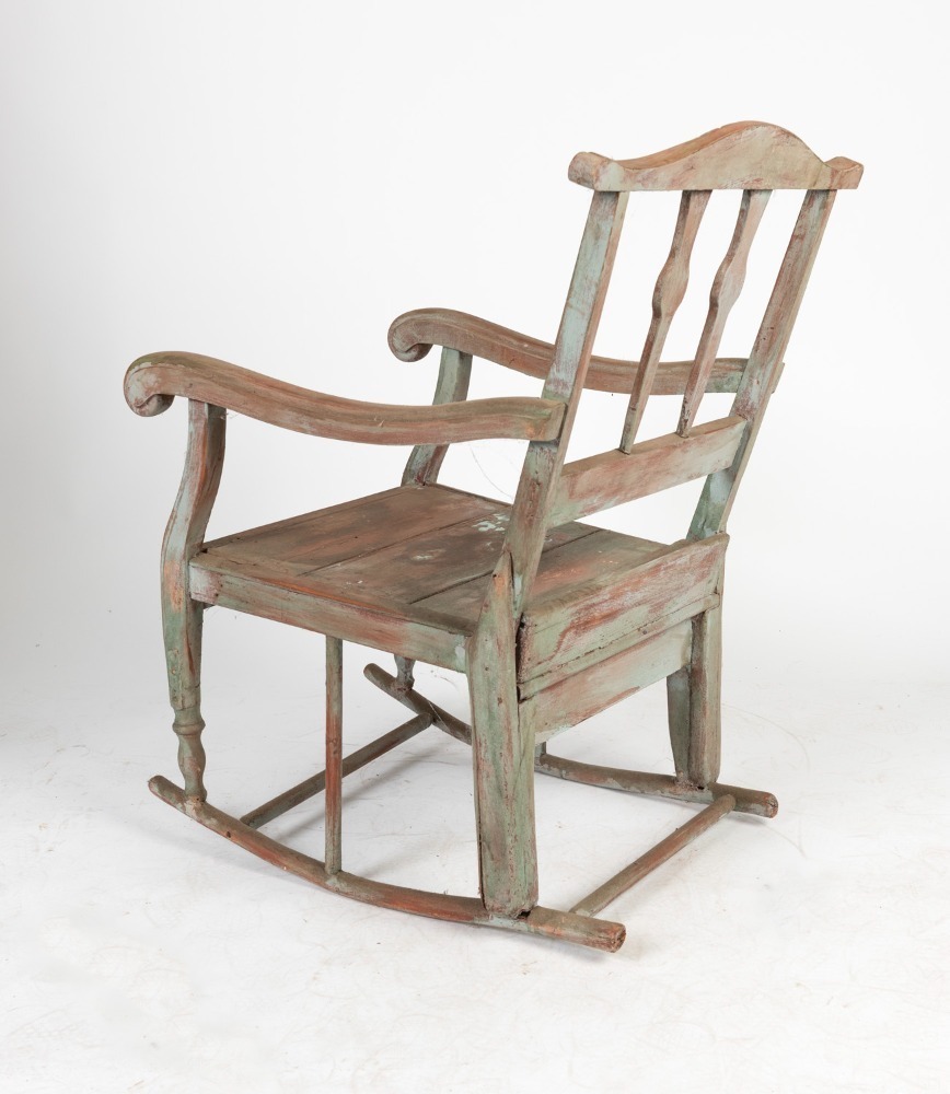 An Australian folk art rocking chair with remains of painted finish ...