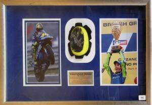 VALENTINO ROSSI: Display comprising signed knee scrape, window mounted with two photographs, framed & glazed, overall 81x50cm. With CoA.