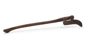 218 · An iron flensing blade with later wooden haft, 19th century, 109cm high overall