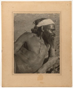 ABORIGINAL MAN, CENTRAL AUSTRALIA: Silver gelatin photographic print, circa 1930-40s, possibly by Charles Mountford, on original board mount with border. Sheet size 21 x 16cm, 29 x 25cm overall