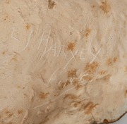 L. J. HARVEY fired plaster mask with bronzed finish, incised "L. J. Harvey", with possible title (illegible), 17cm high - 2