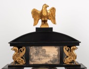 An antique Viennese mantle clock in ebonized Empire architectural case with alabaster columns and water gilt capitals plus griffins and eagle finial. 30 hour quarter gong striking movement with silk suspension and finely engine turned dial, circa 1840, 76 - 2