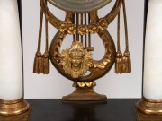 An antique Viennese mantle clock in ebonized Empire architectural case with alabaster columns and water gilt capitals plus griffins and eagle finial. 30 hour quarter gong striking movement with silk suspension and finely engine turned dial, circa 1840, 76 - 4