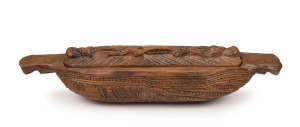 A Maori treasure box, carved wood and paua shell, 19th/20th century, 43cm wide