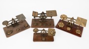 Four antique postal scales with assorted brass weights, 19th/20th century, ​​​​​​​the largest 21cm wide