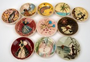 MARTIN BOYD & GUY BOYD group of eleven pottery dishes and plaques with Aboriginal motifs, landscapes, wildflowers and female figures, ​​​​​​​the largest 13.5cm diameter.