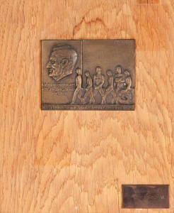 VICTORIAN OLYMPIC COUNCIL TROPHY: Plaque designed by Andor Mezaros (who also designed the 1956 Melbourne Olympics Participation Medal), with bronze depicting Wilfred Kent Hughes 1895-1970, athletes with wreath and text "The Tribute of The Victorian Olympi