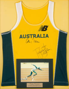 CATHY FREEMAN: Display comprising Australian singlet signed by Cathy Freeman & Tim Forsyth, window mounted, framed & glazed, overall 68x79cm.