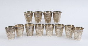 124 · A set of 12 Indian silver beakers, 20th century, stamped "Sterling Silver", ​5.5cm high, 300 grams total