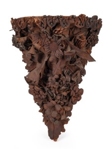 A rare antique Australian floral leather work wall bracket, 19th century, ​​​​​​​45cm high, 33cm wide, 22cm deep.