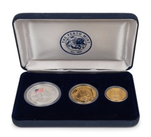 2002 TRIBUTE TO FREEDOM Three-coin Proof set from The Perth Mint: comprising of a $100 (1oz) pure gold "Nugget" with Liberty Bell privy mark; a $50 (½oz) pure gold "Nugget" with Liberty Bell privy mark; and a $1 silver "Kookaburra" with US flag, presented in the felt-lined case of issue. Accompanied by the Certificate of Authenticity identifying this a Set No.195 of only 499 produced.