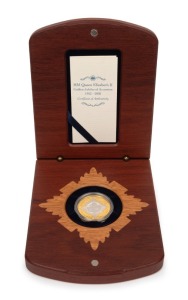2002 $20 bi-metal Golden Jubilee of Accession 1952-2002 silver and pure gold ½oz coin which depicts Queen Elizabeth with Buckingham Palace in the background. Attractively presented in a felt-lined timber case, with Certificate of Authenticity for No.0889.