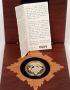 2002 $20 bi-metal Golden Jubilee of Accession 1952-2002 silver and pure gold &frac12;oz coin which depicts Queen Elizabeth with Buckingham Palace in the background. Attractively presented in a felt-lined timber case, with Certificate of Authenticity for No.0889. - 2