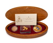 2004 AUSTRALIAN PROSPECTOR COLLECTION from The Perth Mint: comprising of&nbsp; the $100 (1oz) Eureka Stockade pure gold coin, an uncirculated 1904P Sovereign,&nbsp;and several loose Gold Nuggets weighing 7.93 grams. All presented in an oval-shaped timber case featu