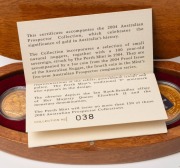 2004 AUSTRALIAN PROSPECTOR COLLECTION from The Perth Mint: comprising of&nbsp; the $100 (1oz) Eureka Stockade pure gold coin, an uncirculated 1904P Sovereign,&nbsp;and several loose Gold Nuggets weighing 7.93 grams. All presented in an oval-shaped timber case featu - 2
