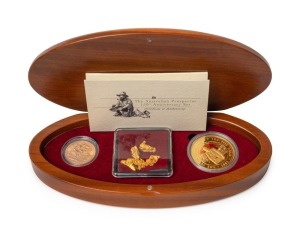 2001 AUSTRALIAN PROSPECTOR COLLECTION from The Perth Mint: comprising of the $100 (1oz) Prospector panning pure gold coin, an uncirculated 1931P Sovereign, and several loose Gold Nuggets weighing 7.88 grams. All presented in an oval-shaped timber case featuring a prospector with his dry blowing equipment and accompanied by a Certificate of Authenticity numbered 051 of only 250 produced.