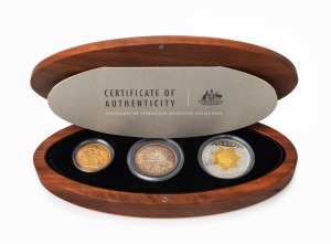 The CENTENARY OF AUSTRALIA MILESTONE COLLECTION: 2001 three coin collection presented in a custom-made oval timber case, comprising of an uncirculated 1901M Sovereign, an uncirculated 1951 50th Anniversary Florin, and a $20 bi-metal Federation commemorative coin; with Certificate of Authenticity for Set No.221 of only 285 produced.