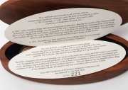 The CENTENARY OF AUSTRALIA MILESTONE COLLECTION: 2001 three coin collection presented in a custom-made oval timber case, comprising of an uncirculated 1901M Sovereign, an uncirculated 1951 50th Anniversary Florin, and a $20 bi-metal Federation commemorati - 2