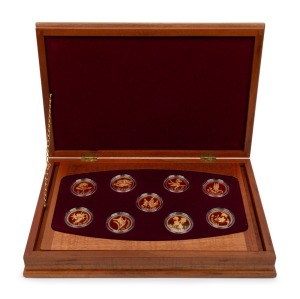 1995 - 2003 FLORAL EMBLEMS OF AUSTRALIA: A complete set of nine PROOF 24ct gold $100 coins presented in a superb timber case with felt lining; each coin accompanied by its' own Certificate of Authenticity and Limitation; and the booklet which accompanies the whole set.