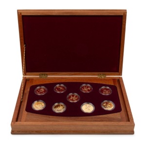 1995 - 2003 FLORAL EMBLEMS OF AUSTRALIA: A complete set of nine uncirculated 22ct gold $100 coins presented in a superb timber case with felt lining; each coin accompanied by its' own Certificate of Authenticity and Limitation; and the booklet which accompanies the whole set.